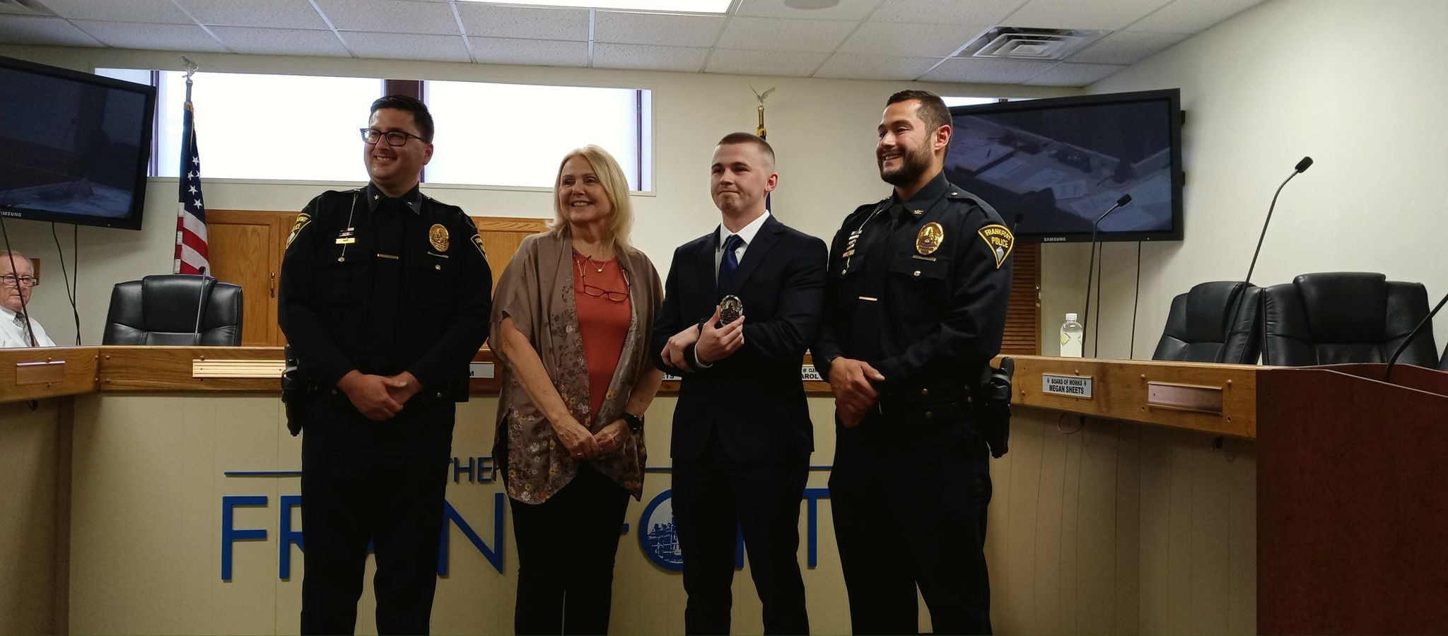 Photo of Ethan Cunningham after being sworn in by Frankfort Mayor Judy Sheets as a Frankfort Police Officer